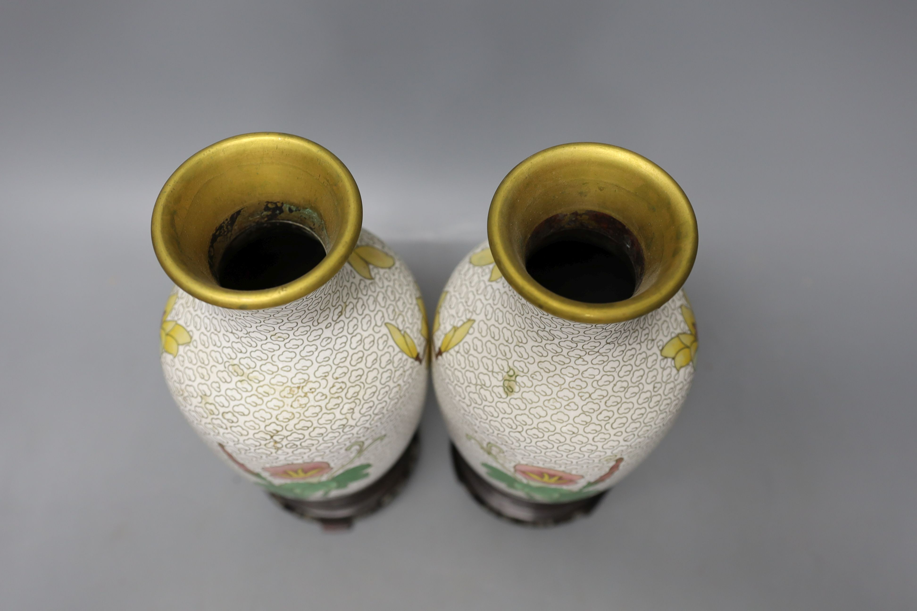 A pair of Chinese cloisonné enamel vases, 25cm tall including stands, together with a Chinese cloisonné enamel dragon bowl (3)